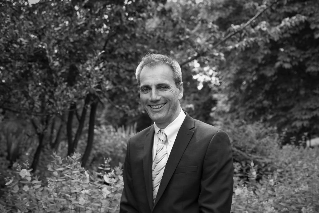 Black and white photo of Dave Wilson, Managing Director of Tiger Eye Consulting Ltd